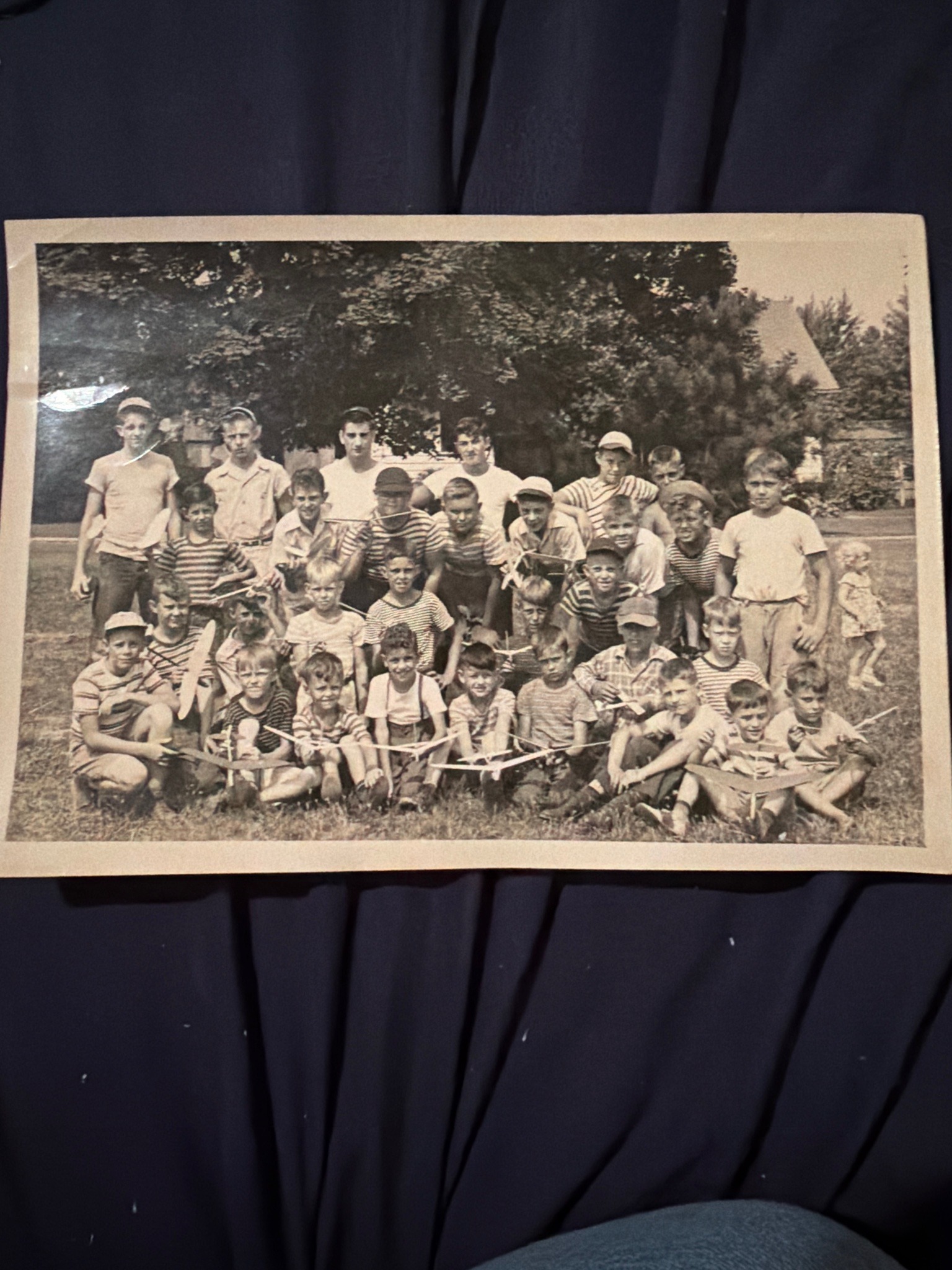 Submitted photo of Vintage black and white photograph depicting a group of boys with model airplanes