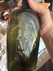Historic Figure Embossed Glass Bottle