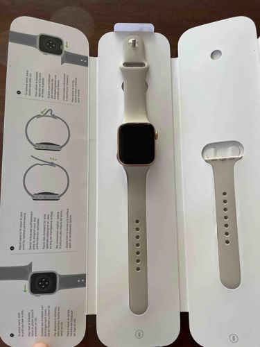 Apple Watch with Gold Aluminum Case and Starlight Sport Band