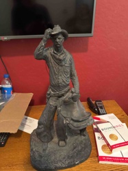 Cowboy with Saddle Figurine