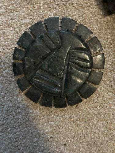 Jadeite or Serpentinite Sun Disk Carving