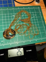 Multi-Strand Gold Beaded Necklace with Black and Gold Crescent Pendant