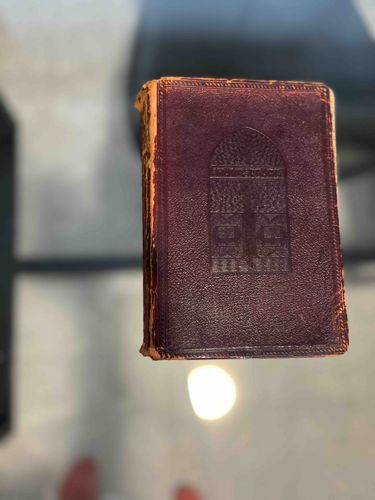 Antique Embossed Leather-Bound Book with Architectural Motif