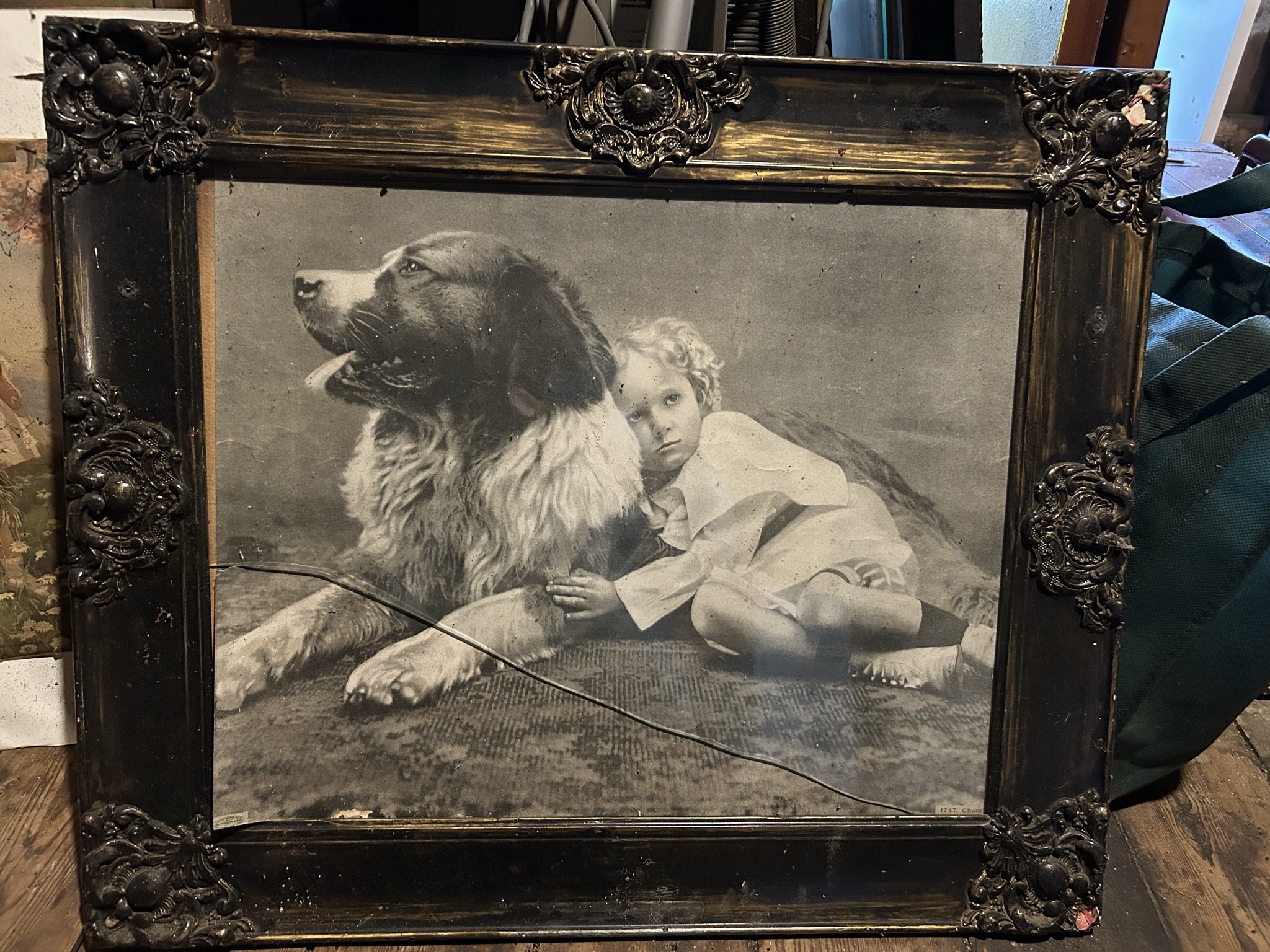 Submitted photo of Vintage framed print depicting a child and dog