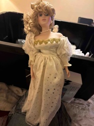Porcelain Doll in Star-Patterned Gown