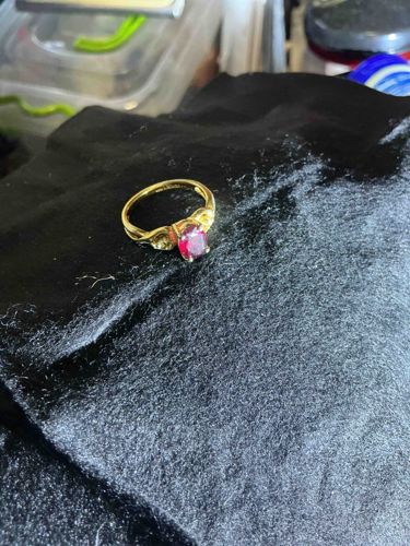 Gold-Toned Ring with Oval Red Gemstone and Accent Stones