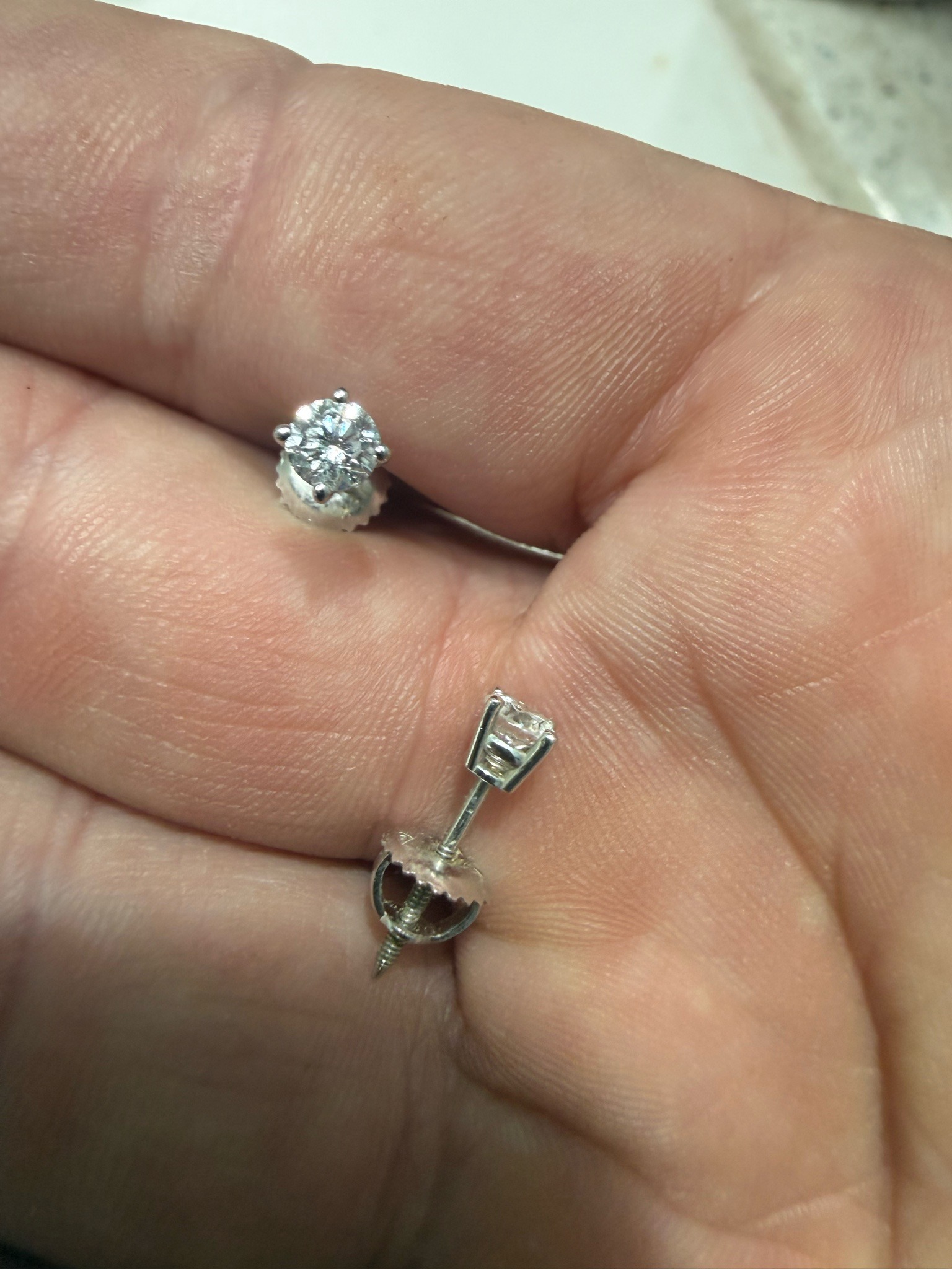 Submitted photo of Diamond solitaire stud earrings (unauthenticated)