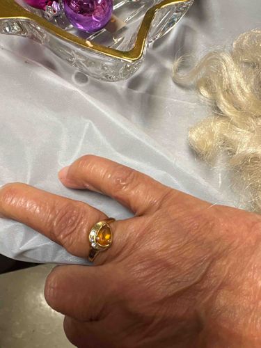 Gold Ring with Pear-Cut Orange Stone and Diamond Accents