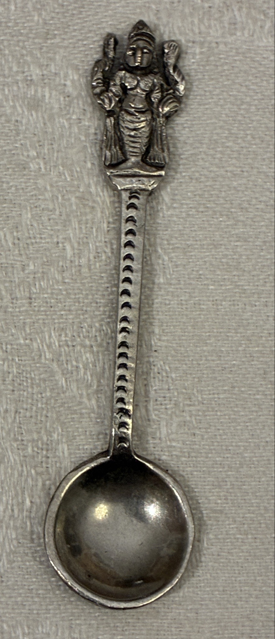 Submitted photo of Decorative metal spoon with figural finial