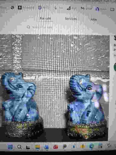 Pair of Seated Blue Elephant Figurines on Decorative Plinths