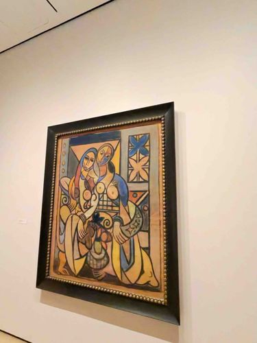 Painting of Two Female Figures with Geometric Patterns