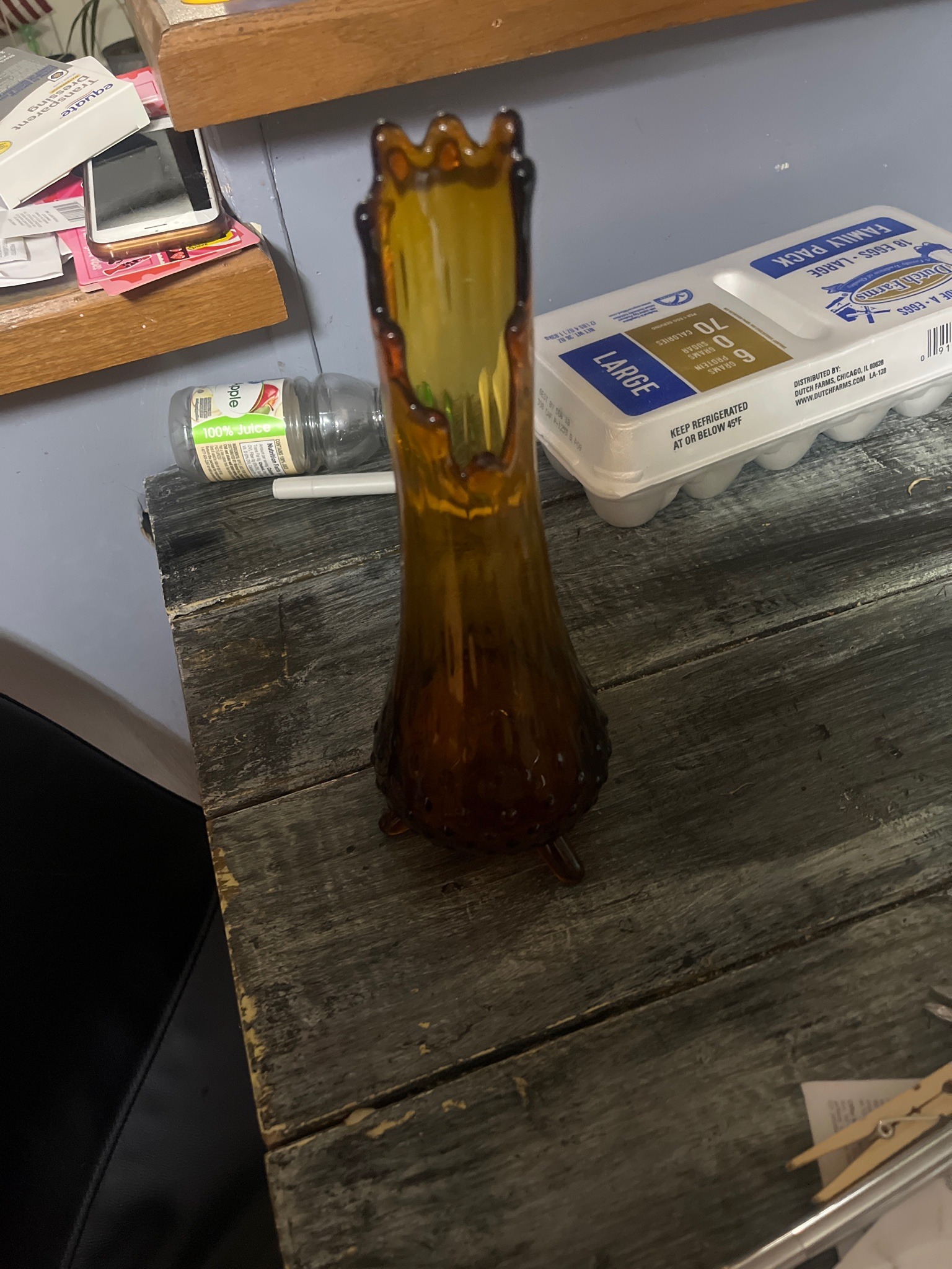 Submitted photo of Amber glass swung vase with three-prong rim and snail foot design
