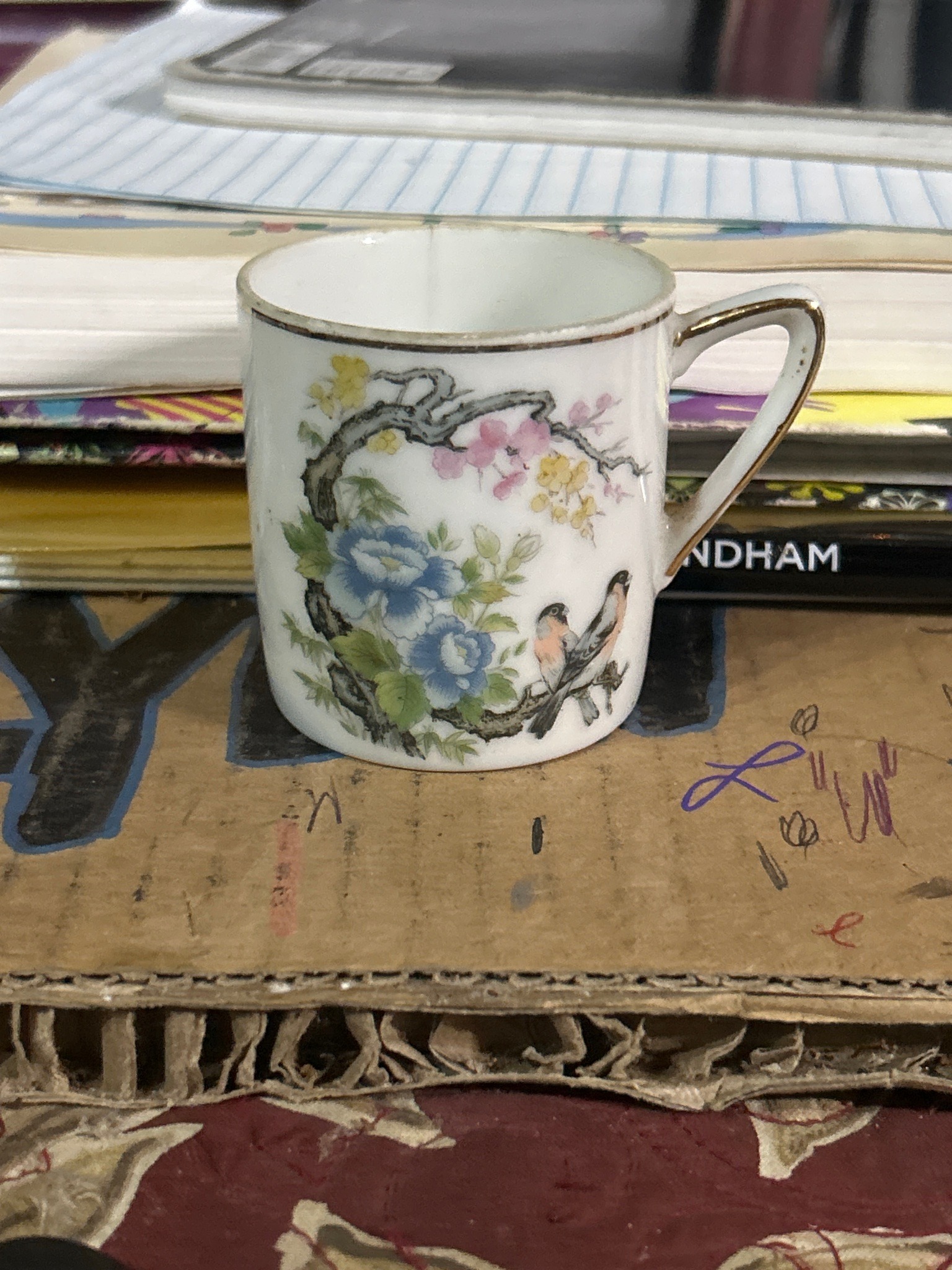 Submitted photo of small ceramic cup in the Asian decorative style