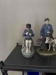 Porcelain Figurine of a Boy Mending a Fishing Net