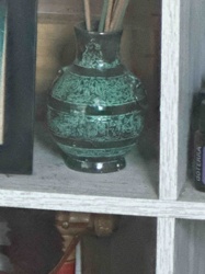 Antiqued Green Ceramic Vase with Incense Sticks