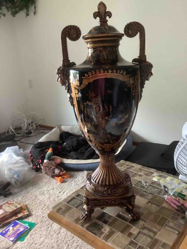 Ornate Black and Gold Decorative Urn with Fleur-de-lis Finial