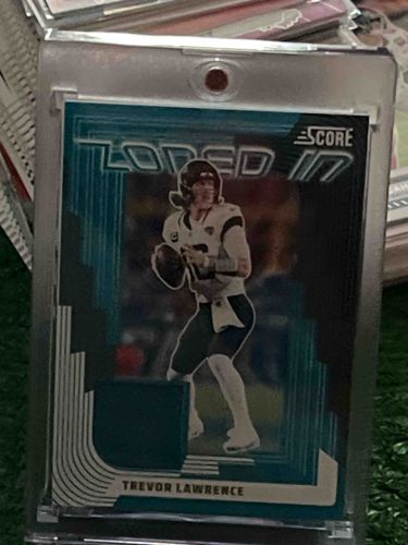 2023 Panini Score Trevor Lawrence 'Locked In' Teal/Green Parallel