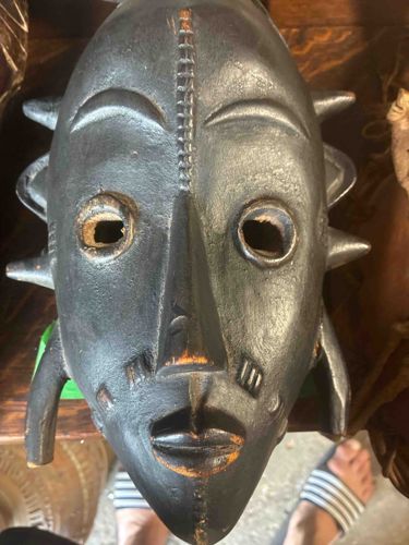 African Tribal Wooden Mask with Spikes and Geometric Carvings