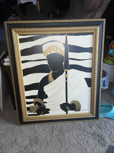 Framed Black, White, and Gold Stylized Figure Artwork