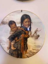 Decorative Collector's Plate depicting a Young Girl with Baby