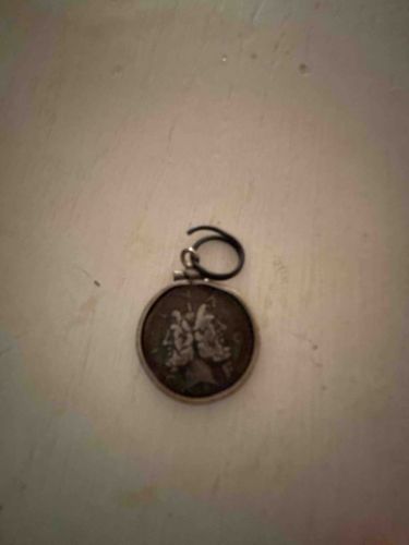 Silver Coin Pendant with Decorative Bezel