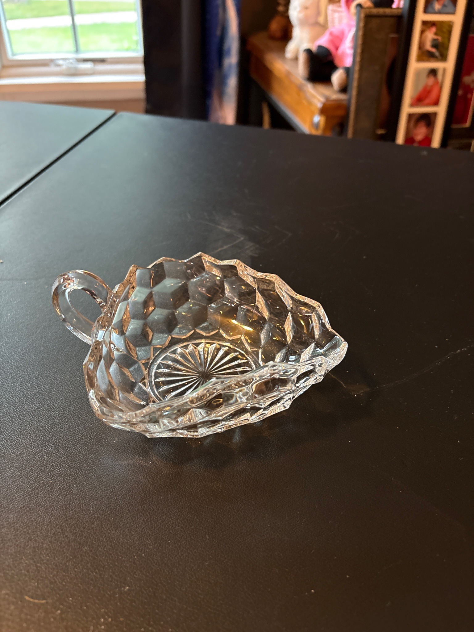 Submitted photo of Pressed glass small handled dish