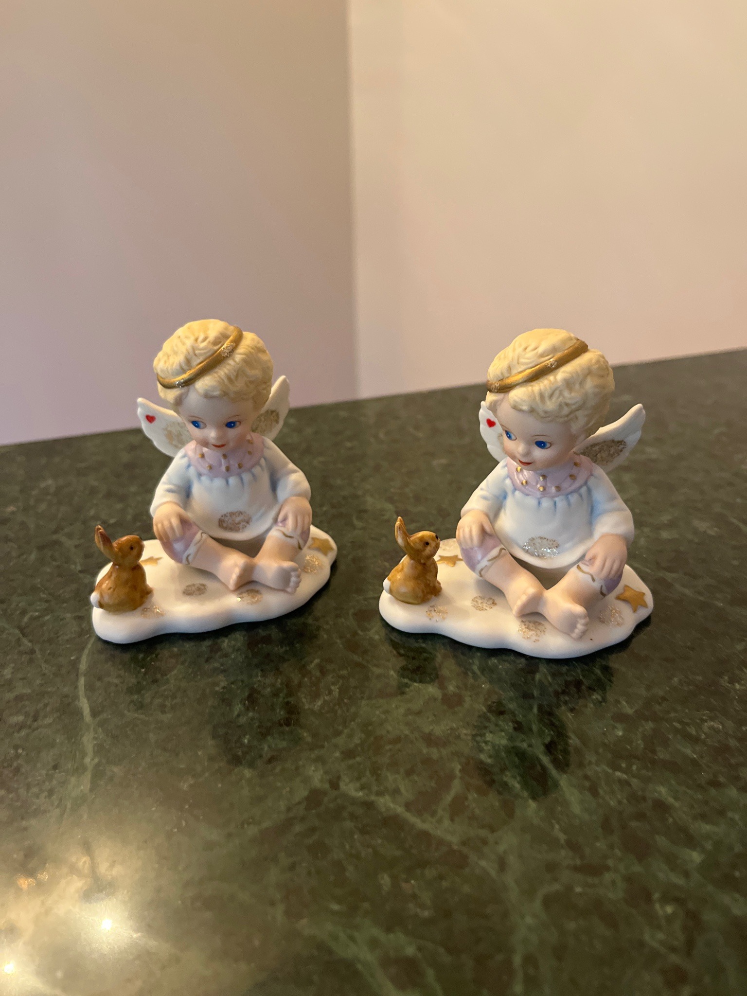Submitted photo of Porcelain angel figurines with rabbits