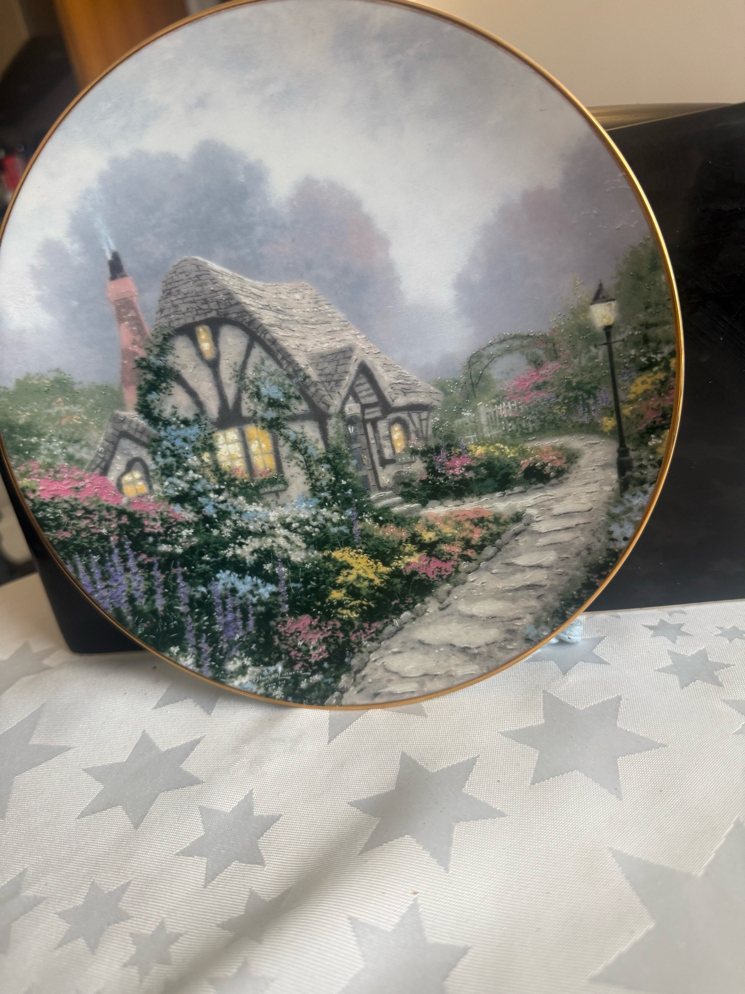 Submitted photo of Decorative collector plate featuring cottage scene