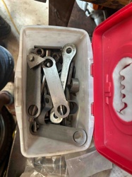 Assorted Metal Linkages and Levers in Plastic Container