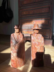 Pair of Carved Red Stone Figures