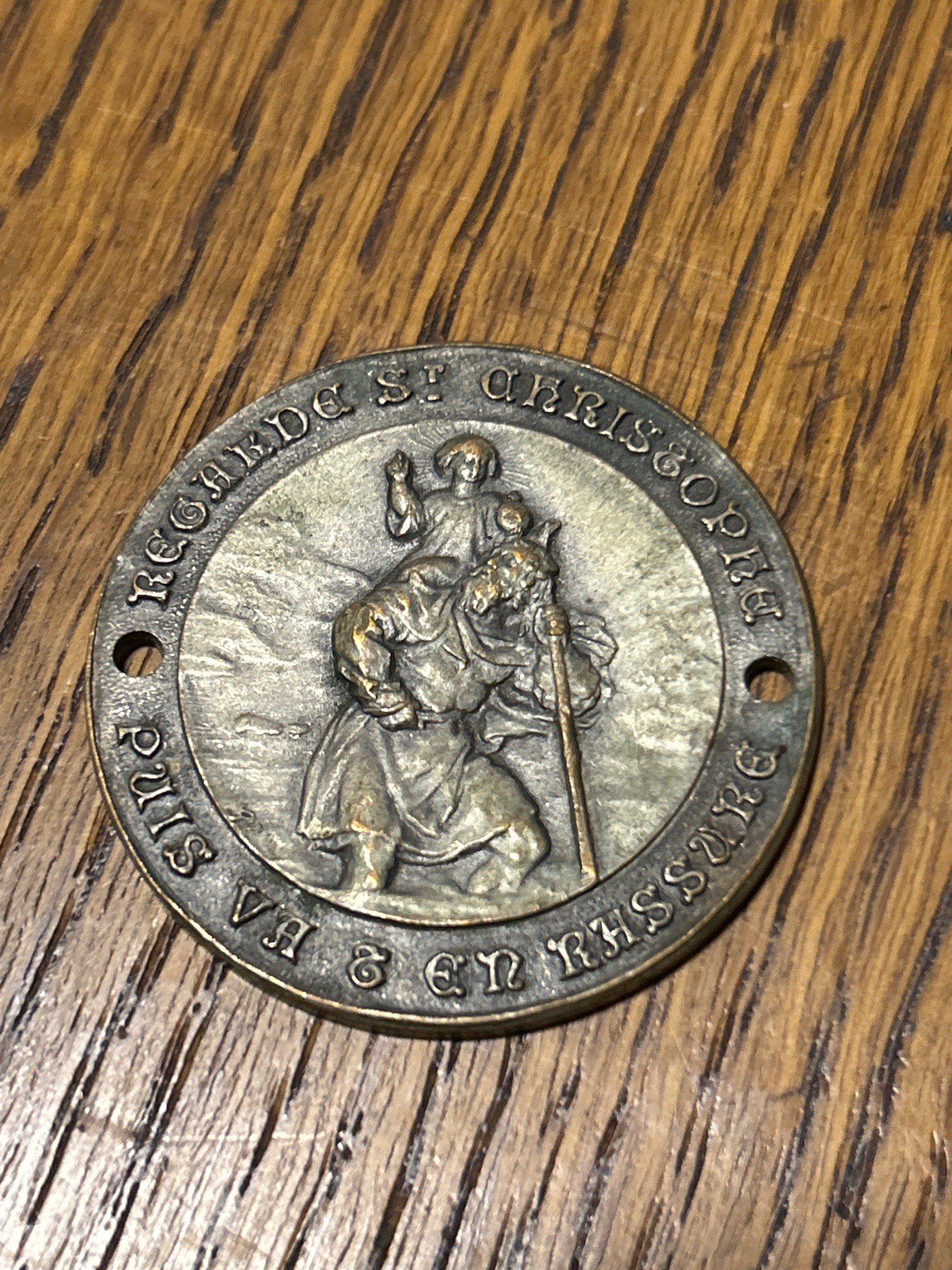 Submitted photo of French St. Christopher medal inscribed 'REGARDE ST CHRISTOPHE PUIS VA & EN RASSURE'