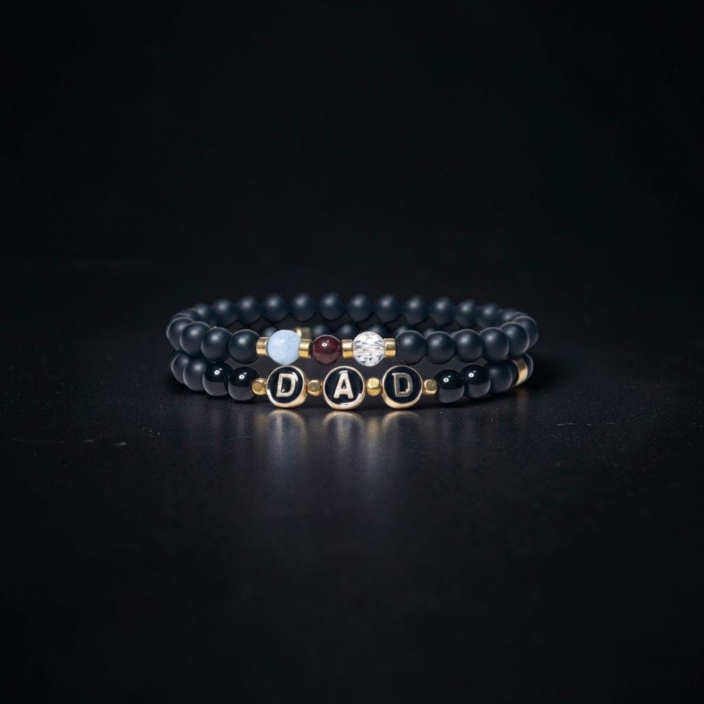 Submitted photo of Beaded stretch bracelet set featuring letter charms spelling 'DAD'