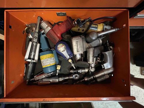 Assorted Power Tools and Accessories in Toolbox