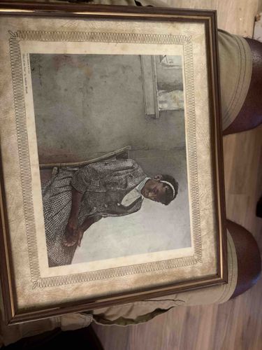 Print of a Seated Girl by Elizabeth Catlett