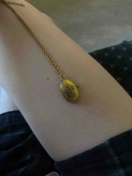 Oval Gold-Toned Locket Necklace with Embossed Design