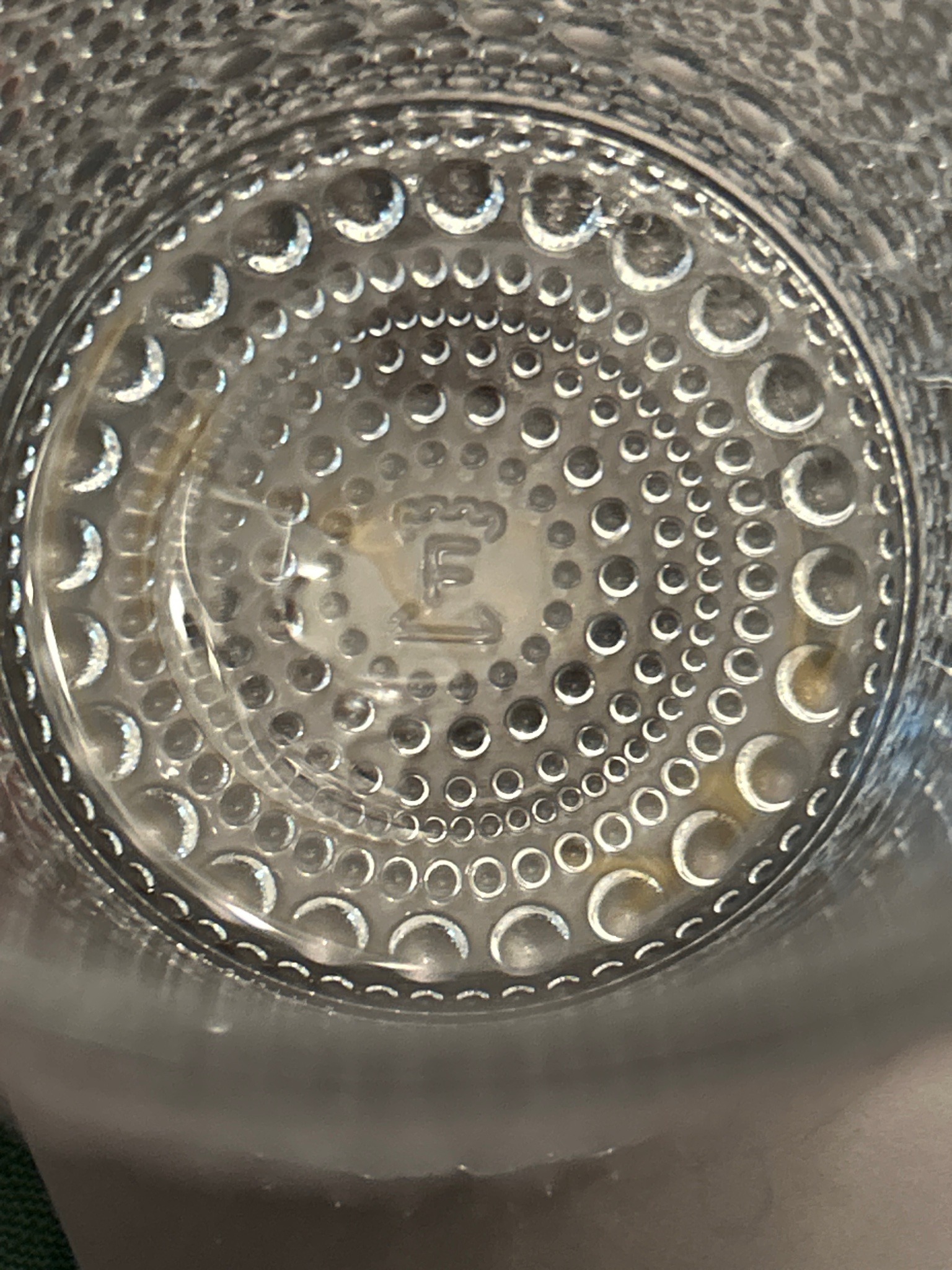 Submitted photo of Pressed glass vessel base with 'F' mark (unverified)