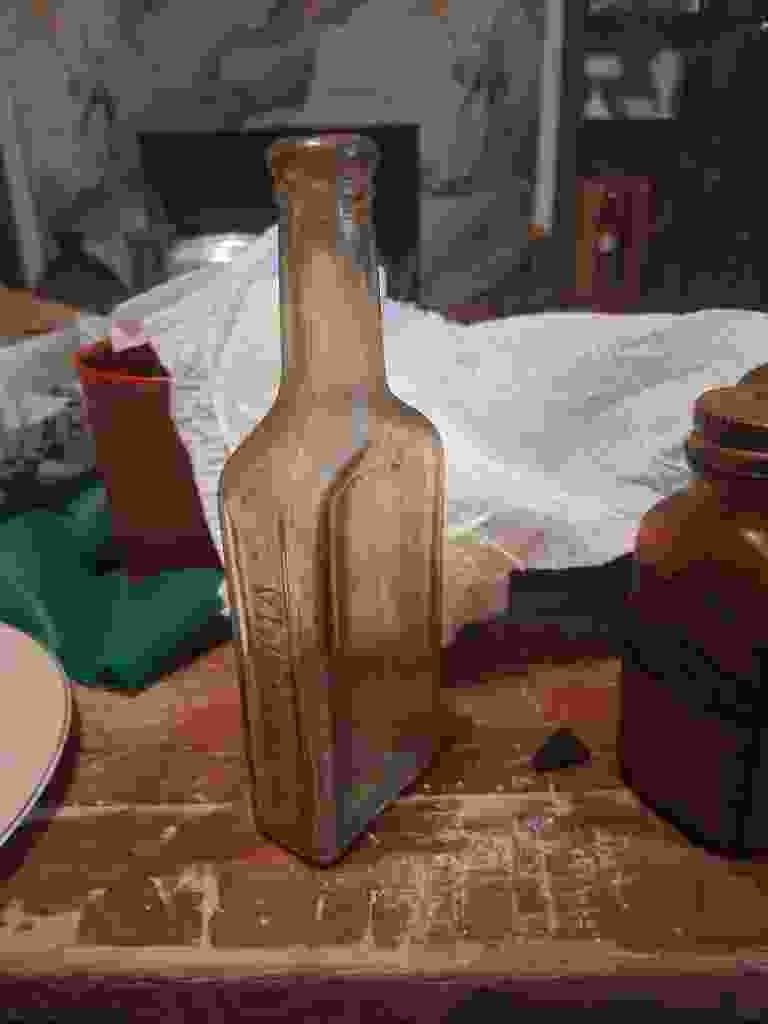 Antique Embossed Amber Glass Medicine Bottle