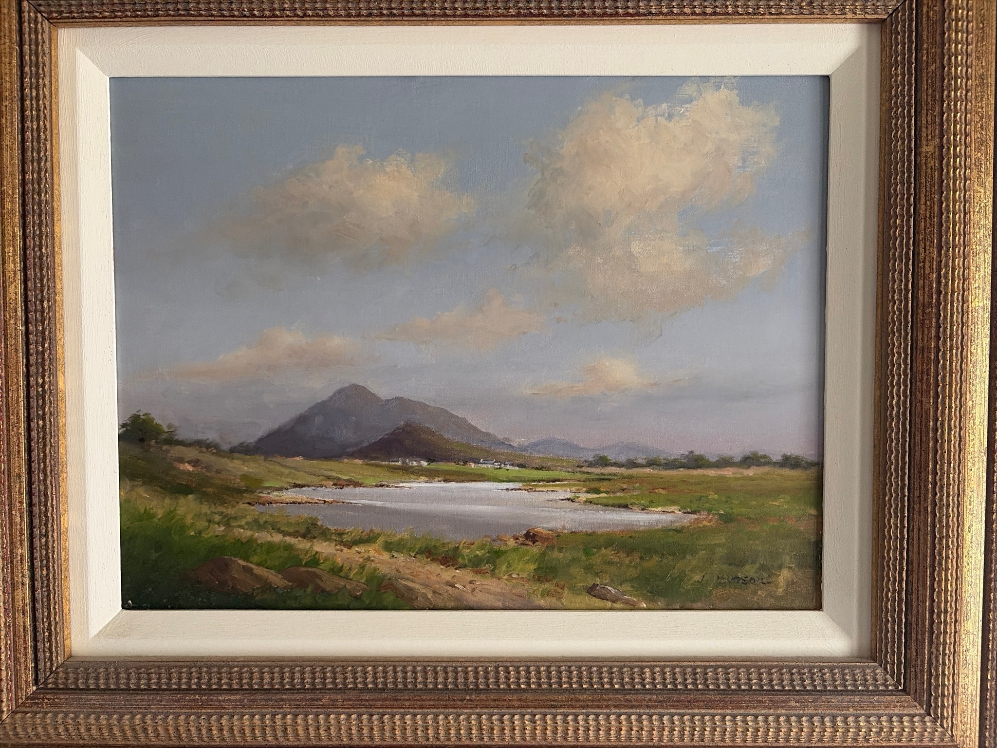 Submitted photo of Oil landscape signed 'J. HUTSON'