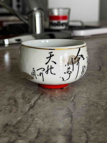 Ceramic Tea Cup with Calligraphy and Red Base