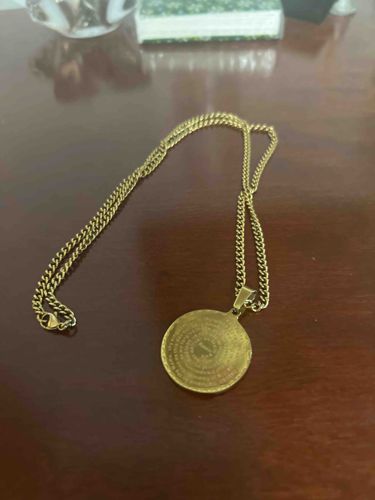 Gold-Tone Circular Pendant Necklace with Engraved Text