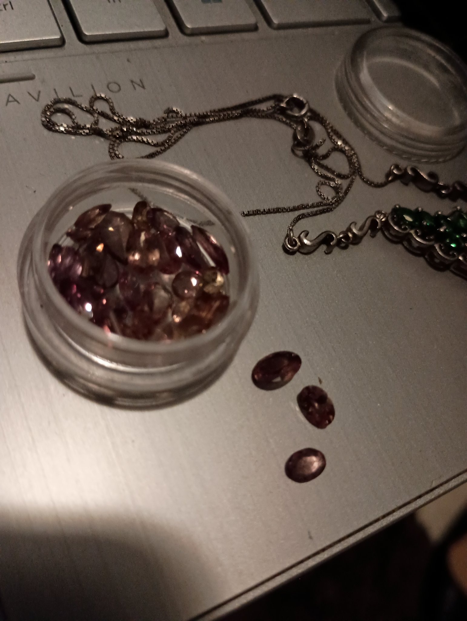 Submitted photo of Loose faceted gemstones in a plastic container