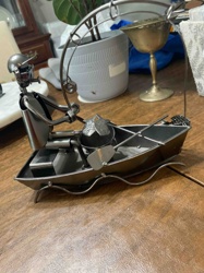 Iron Fisherman and Boat Sculpture with Fish Catch