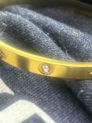 Yellow Metal Bangle Bracelet with Inset Stones