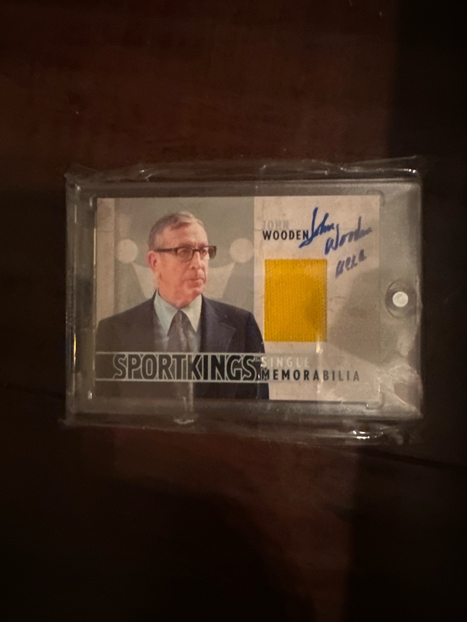 Submitted photo of Sport Kings John Wooden memorabilia trading card (not authenticated)