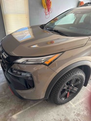 SUV (Likely Nissan Rogue)