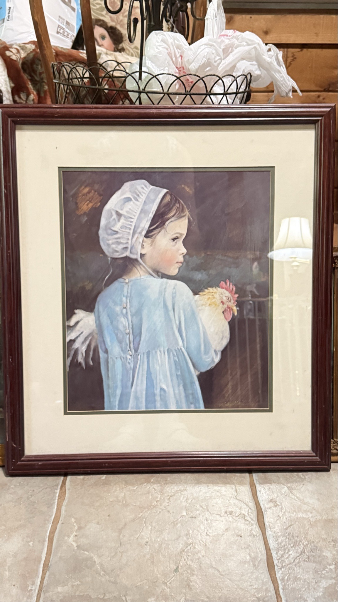 Submitted photo of Framed Print of a Girl Holding a Rooster
