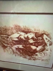 Framed Sepia-Toned Photograph of a Figure in Grass