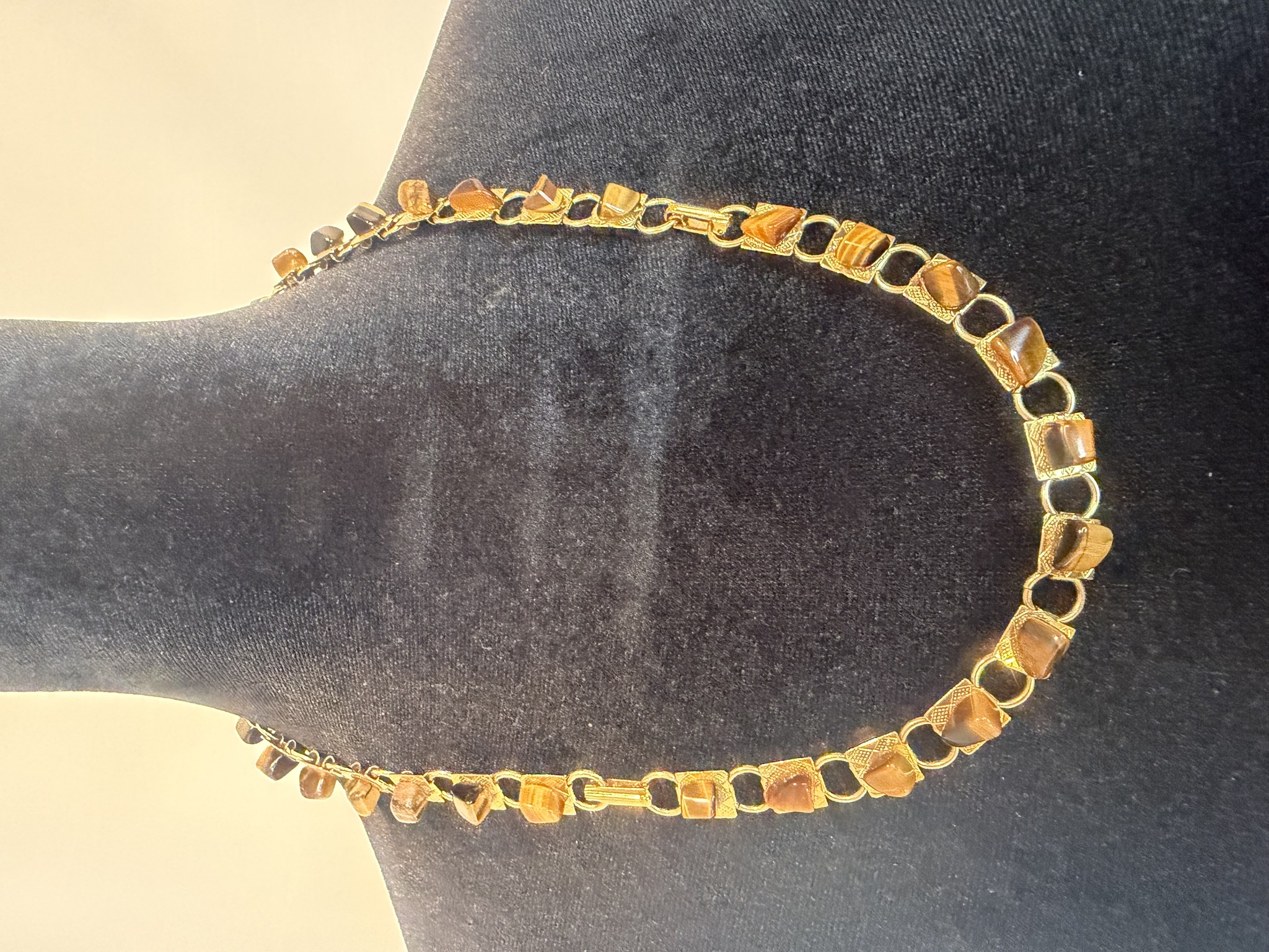 Submitted photo of Gold-tone link necklace with bezel-set tiger's eye stones (unverified maker)