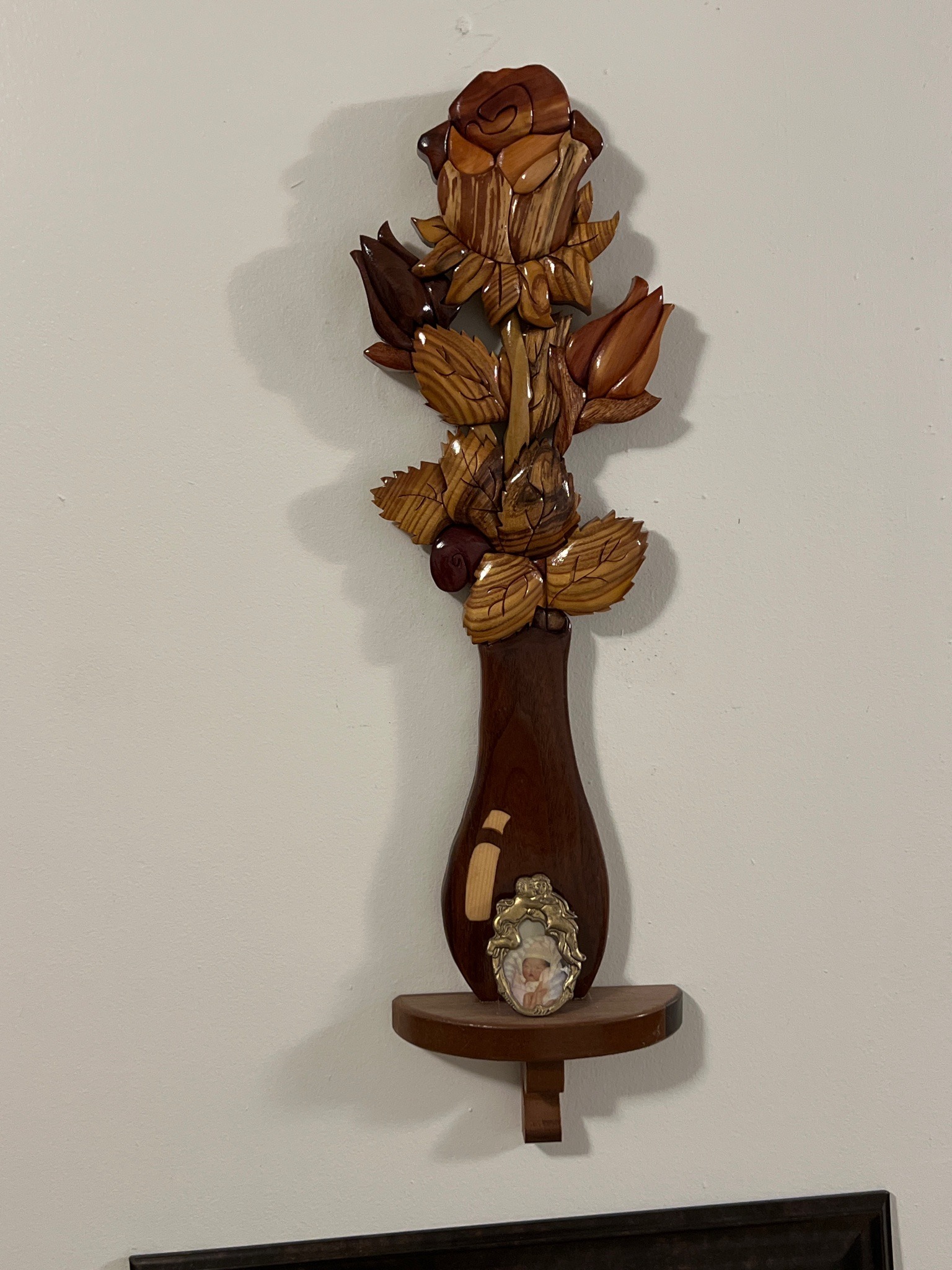 Submitted photo of Intarsia Wood Wall Hanging with Floral Bouquet and Display Shelf