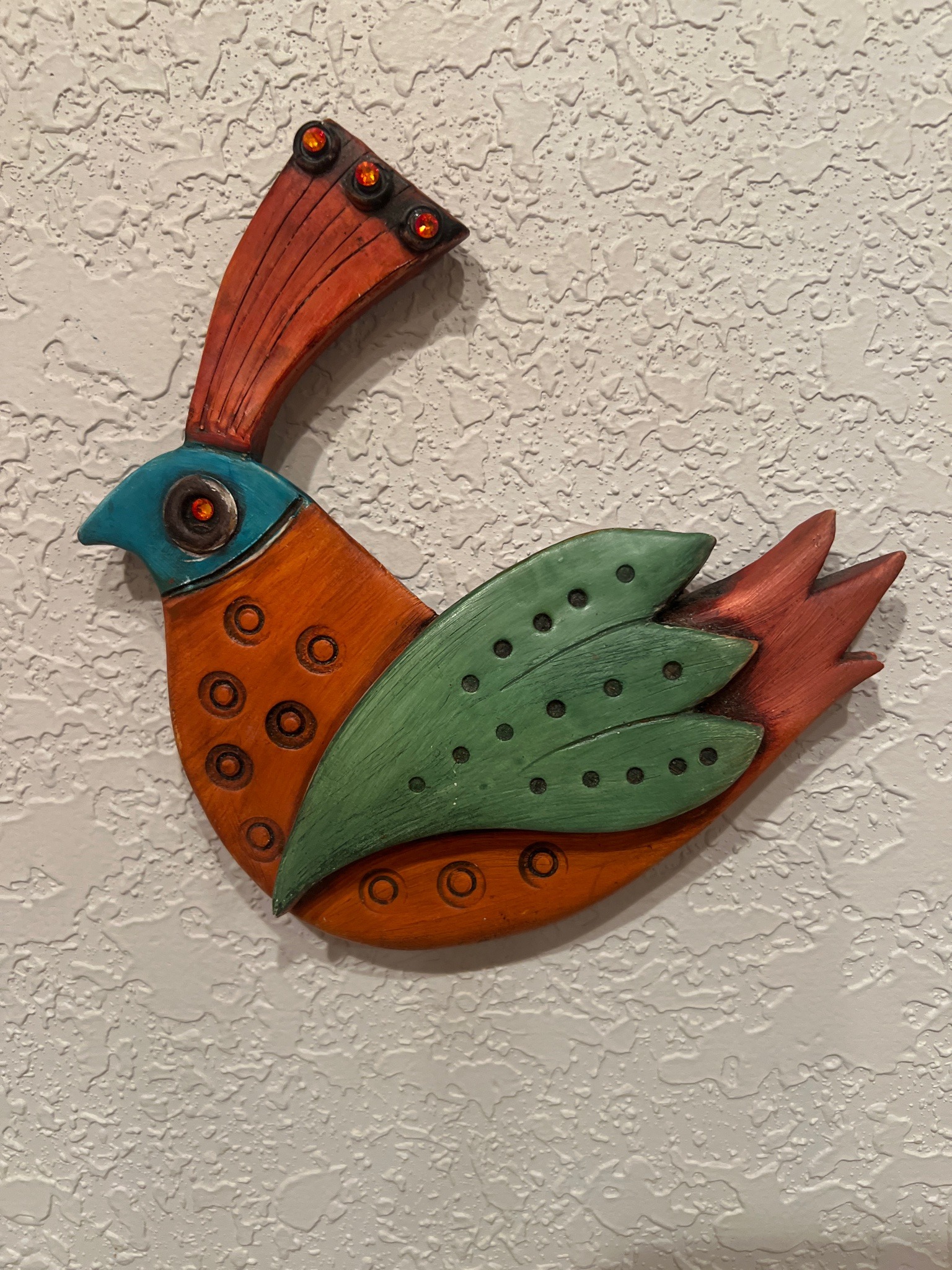 Submitted photo of Carved wooden folk art bird wall hanging